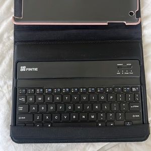 Rose gold iPad case with keyboard.